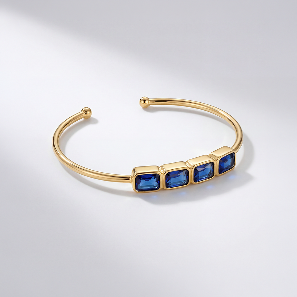 RB Jewelry Linear Cuff - gold open cuff bracelet with row of blue stones