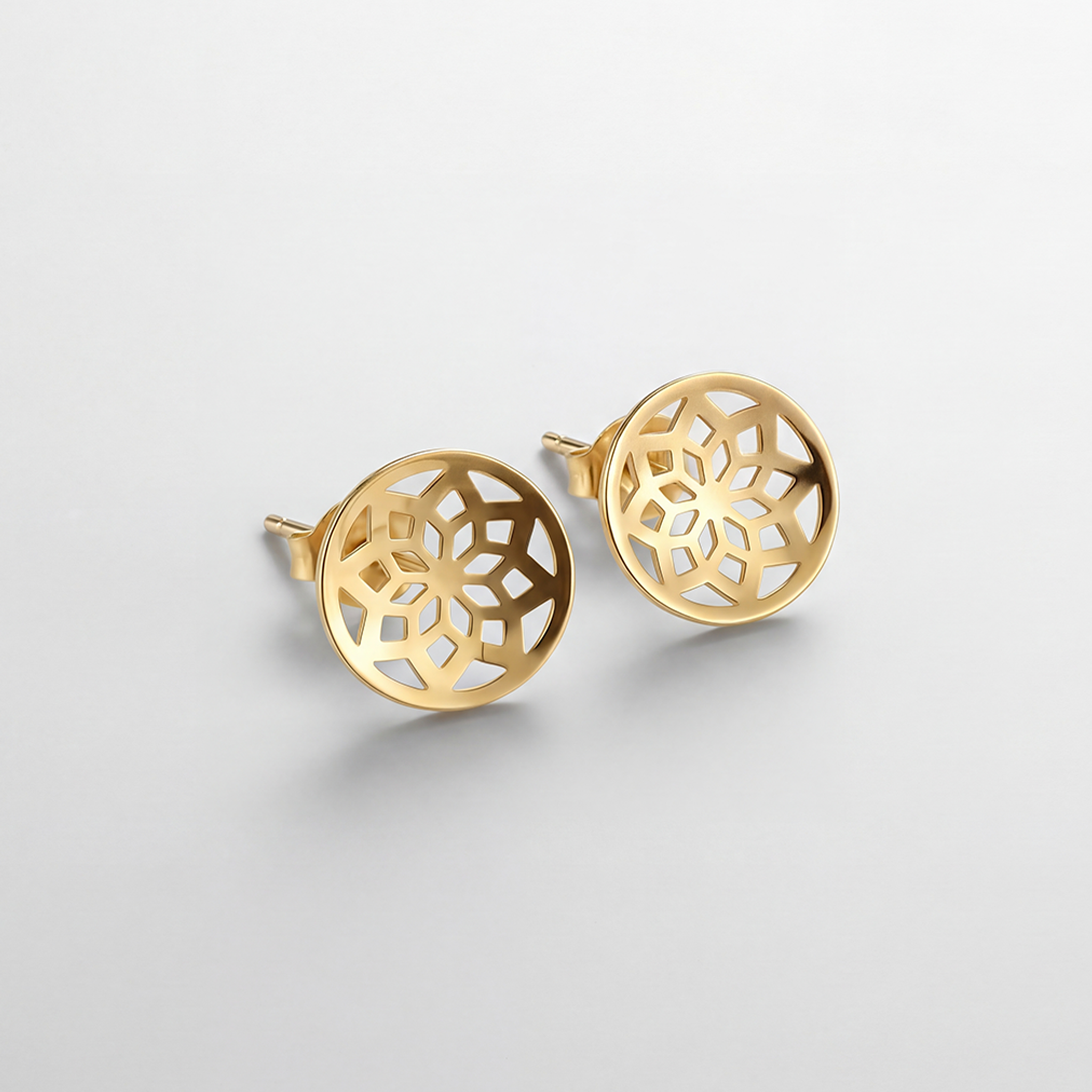 RB Jewelry Arabesque Earrings - detailed gold pattern stud earrings close up